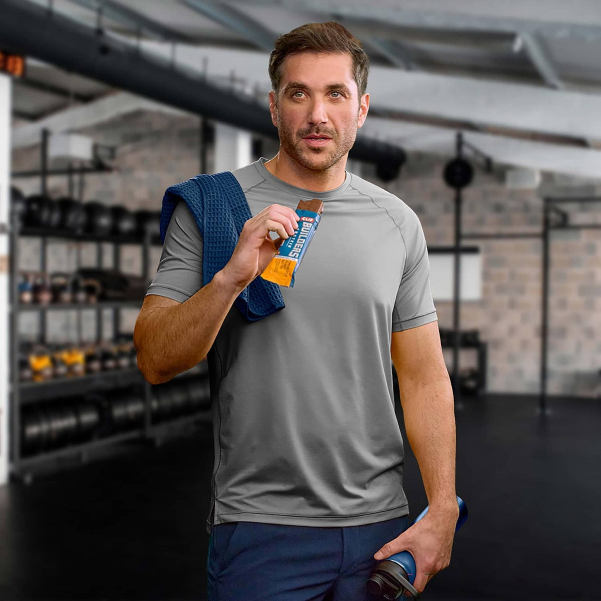 CLIF BUILDERS protein bar held by a shopper