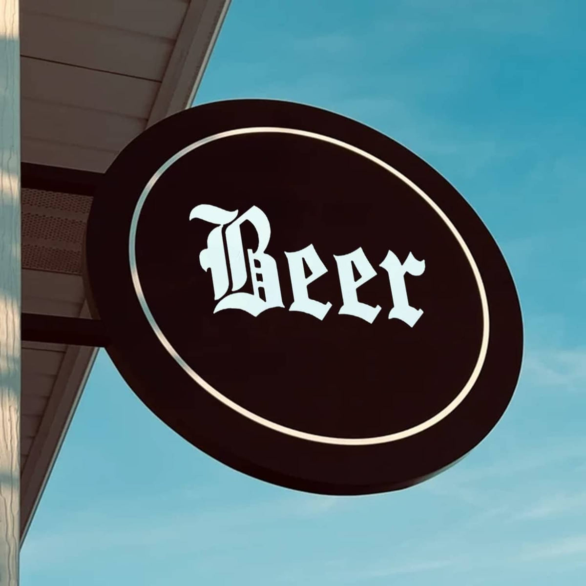 Circular stencil-style Beer lettering sign