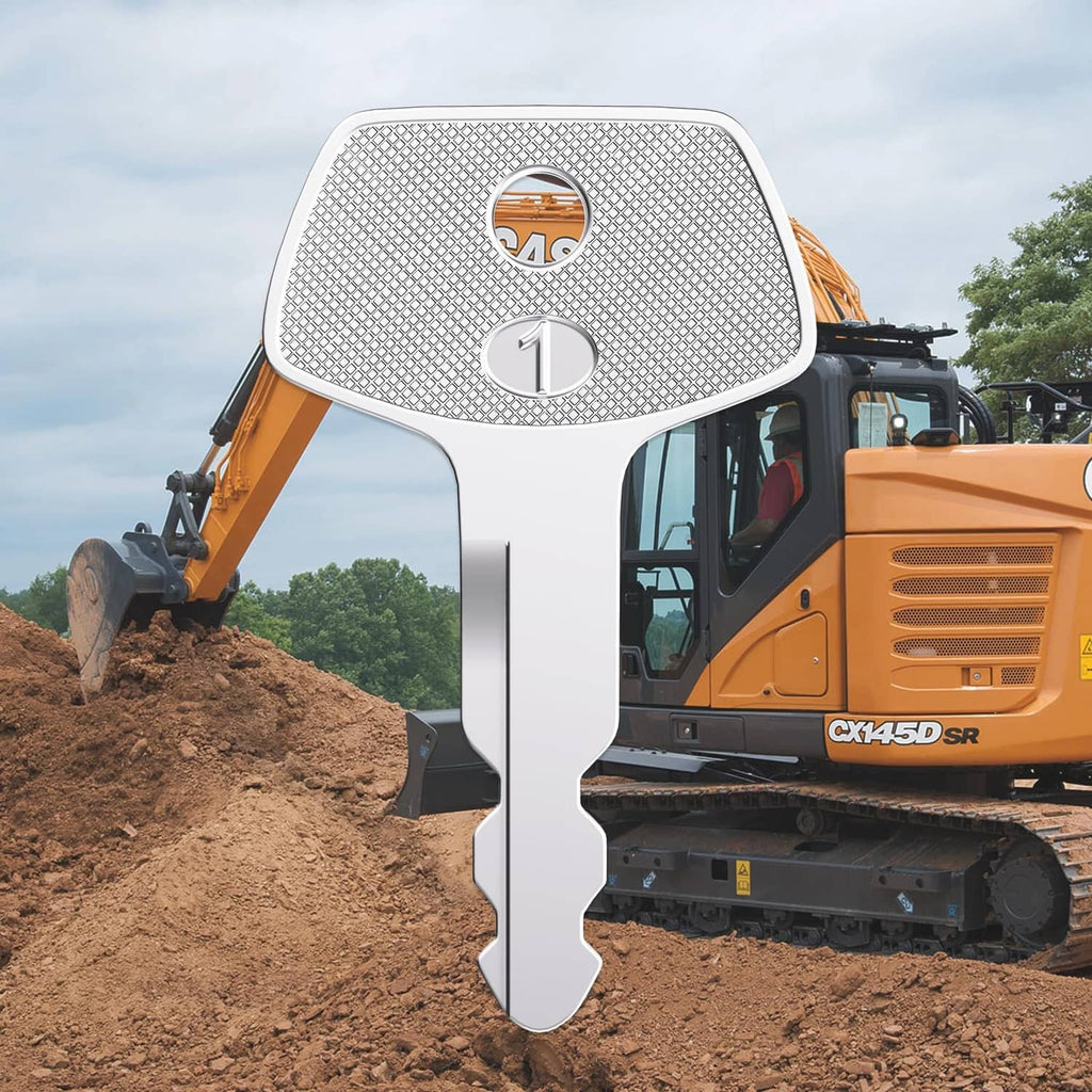 Silver ignition key centered on equipment, textured head with numbered emblem