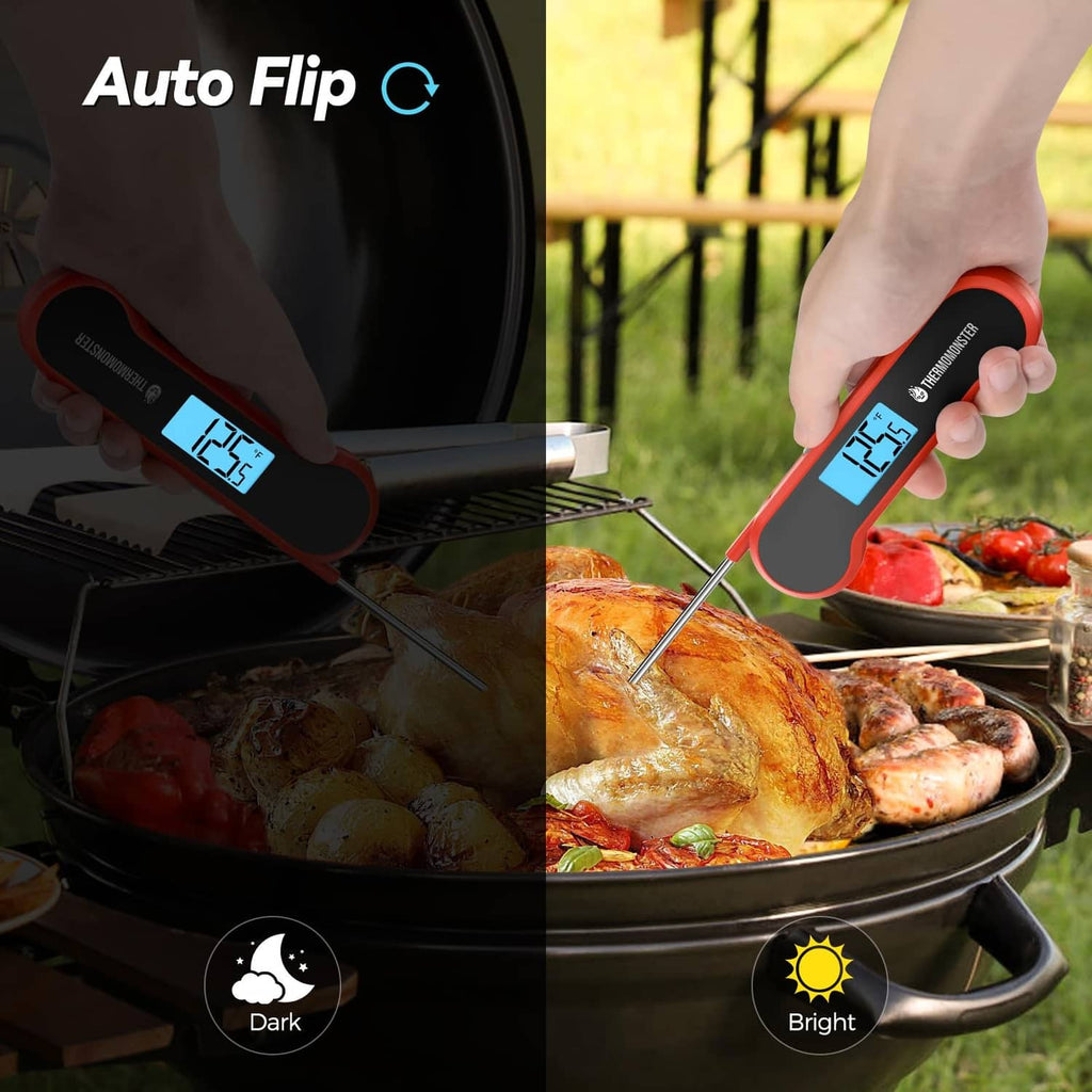 Red digital meat thermometer held near grilled food, blue LCD screen