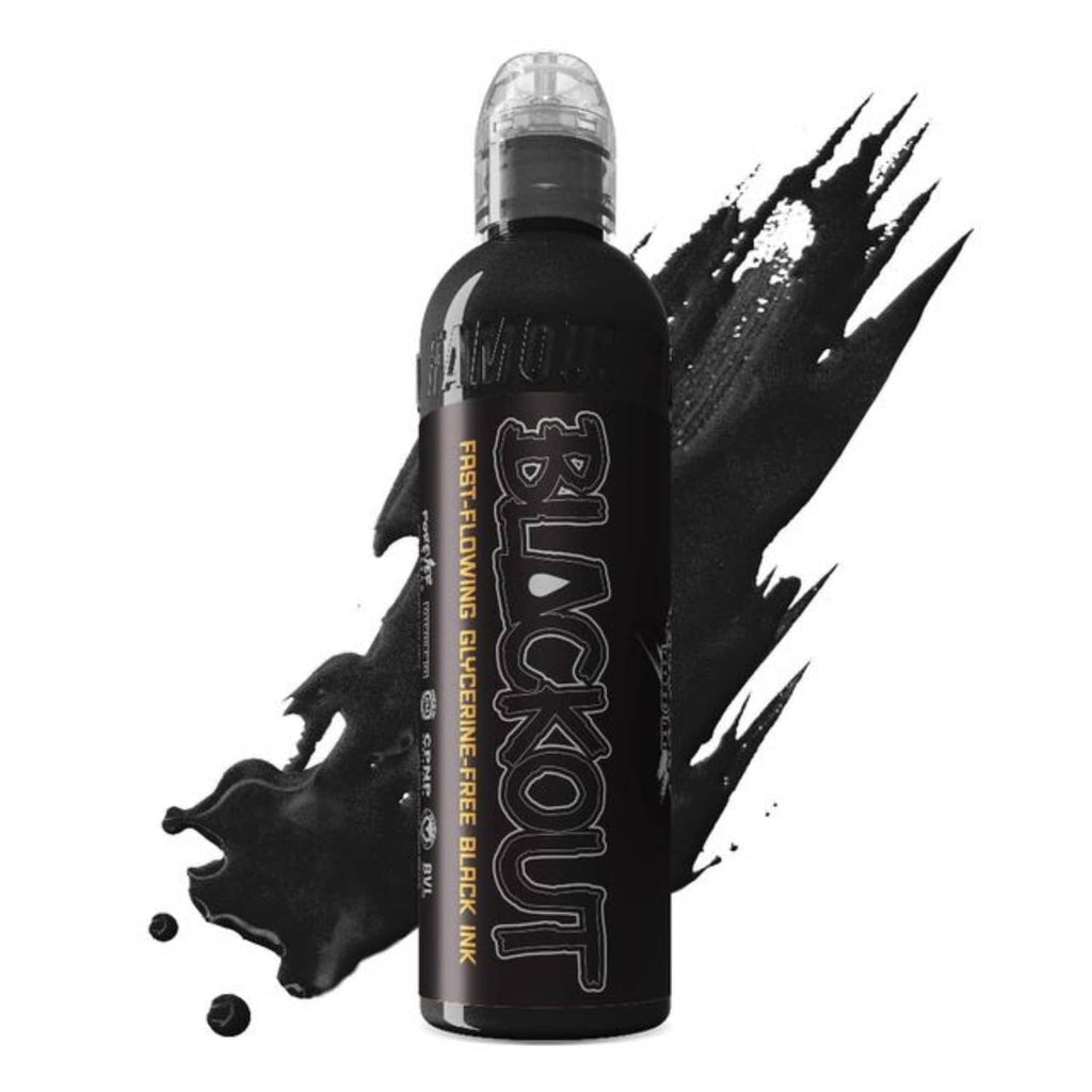 Black tattoo ink bottle with clear cap, shown with black ink splashes