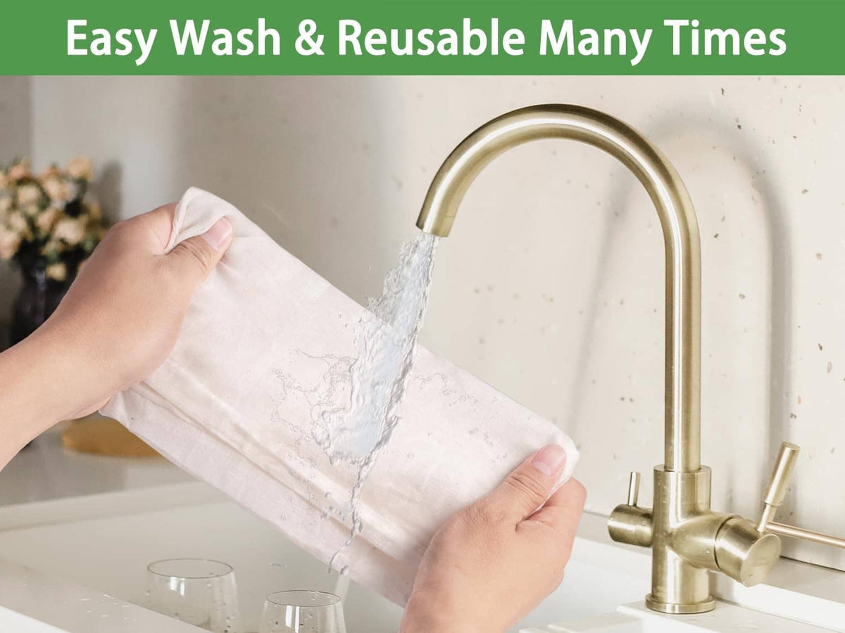 Unbleached cheesecloth rinsed under faucet, light beige fabric ready for reuse