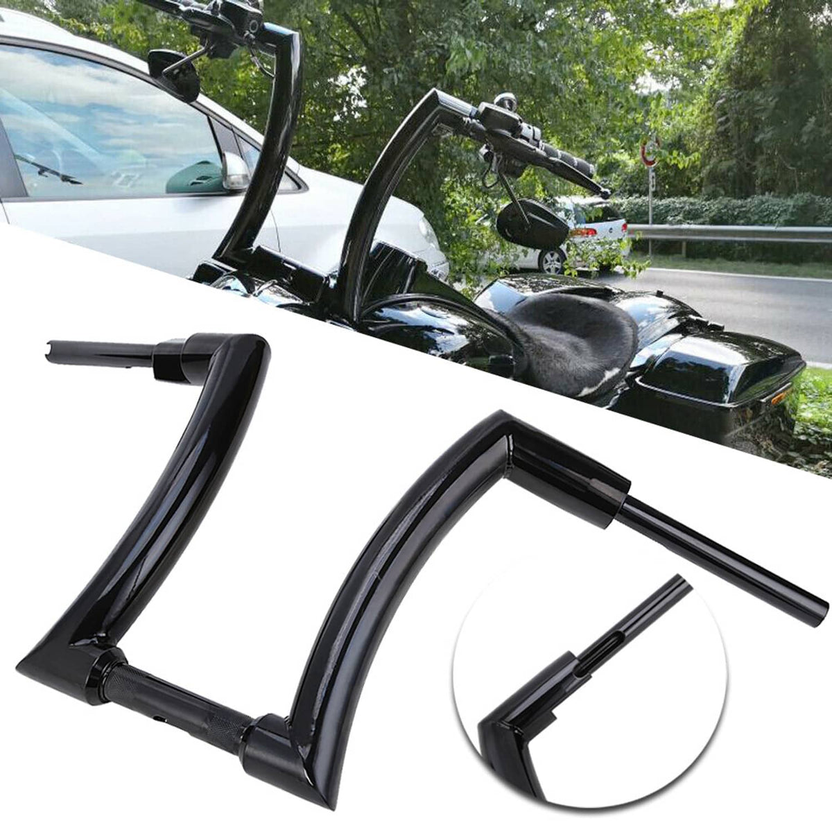 Black ape hanger handlebars with mounted controls and mirrors on motorcycle front