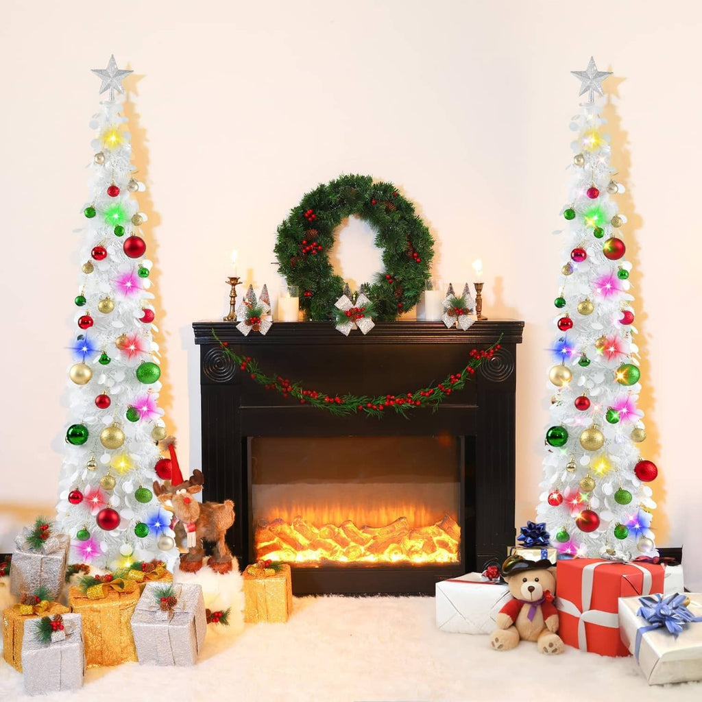 Pair of white pop-up Christmas trees with star toppers, multicolor lights, and ornaments
