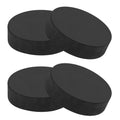 Set of two black round non-slip furniture pads with textured grip surface