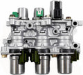 Transmission solenoid block assembly with silver housing, green sensors, and black connectors