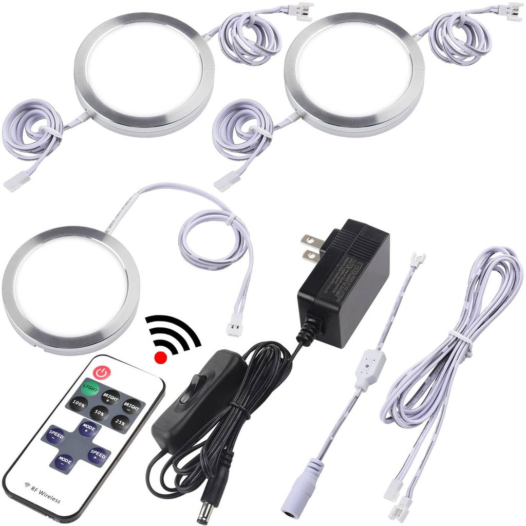 LED puck under-cabinet lights set with round discs, cables, remote, and power adapter