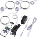 LED puck under-cabinet lights set with round discs, cables, remote, and power adapter