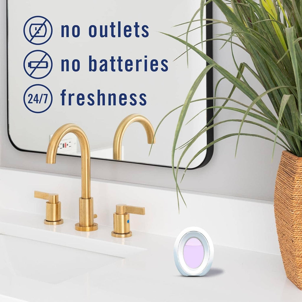 Plug-in air freshener device with lavender round insert on a bathroom counter