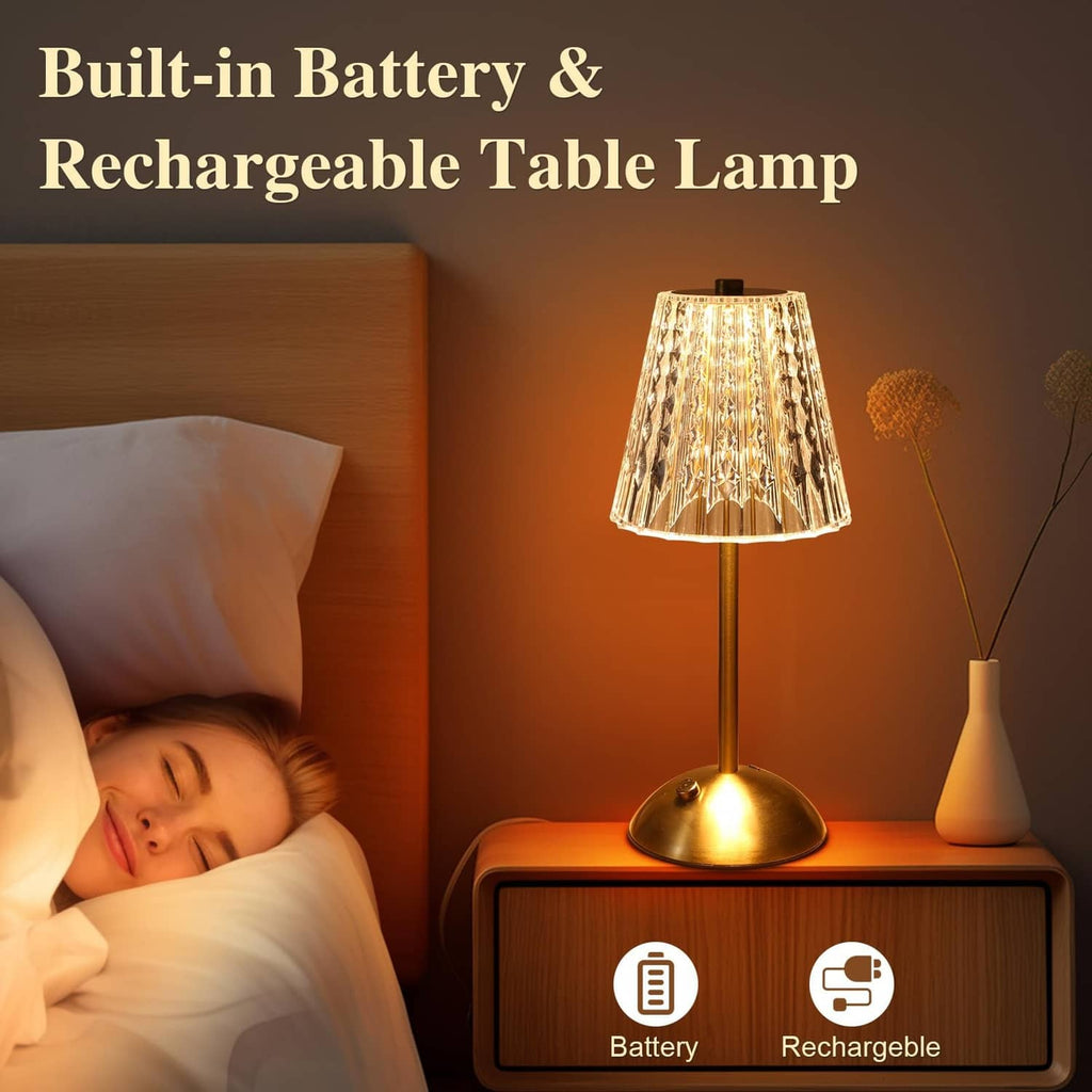 Rechargeable cordless table lamp with gold pedestal base and glowing crystal shade