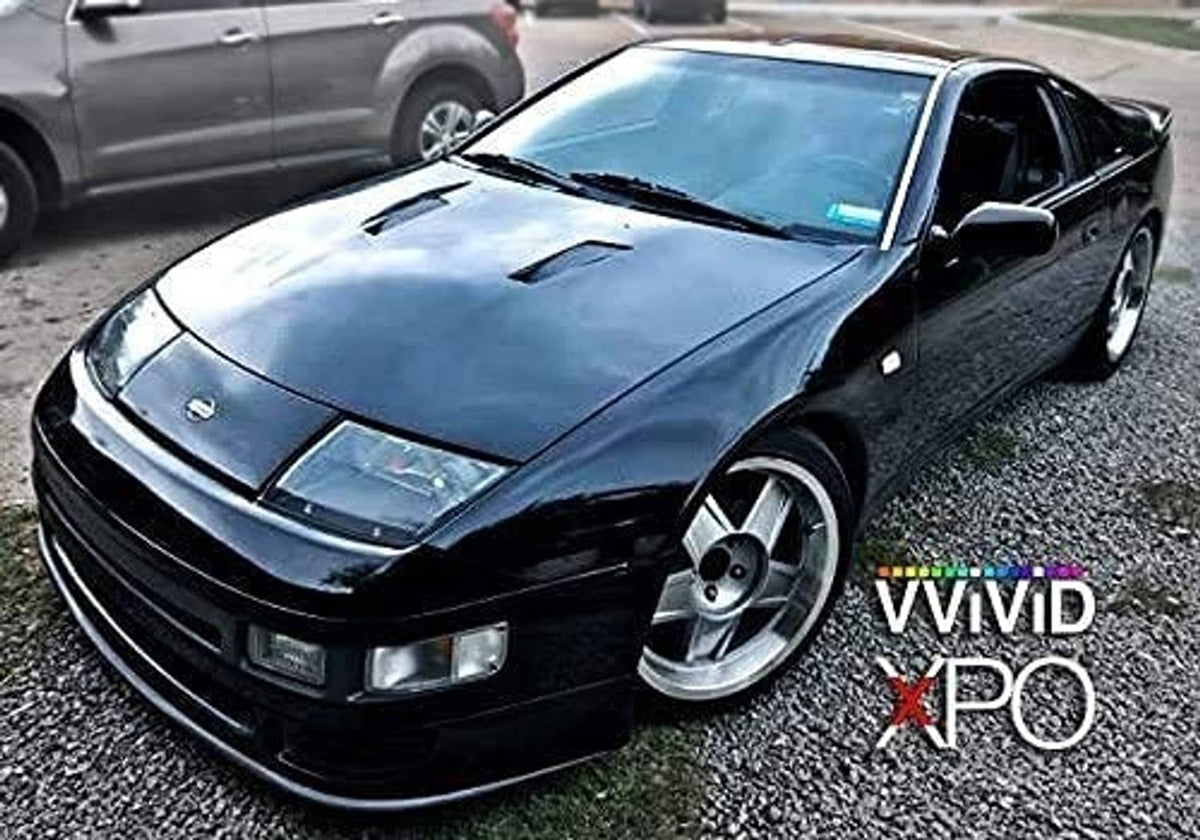 Black high-gloss vinyl-wrapped sports car front with hood detail, realistic paint-like finish