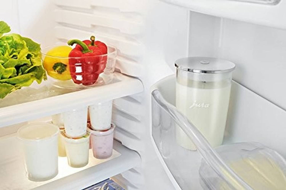 Jura glass milk container on refrigerator shelf, chrome lid and clear body