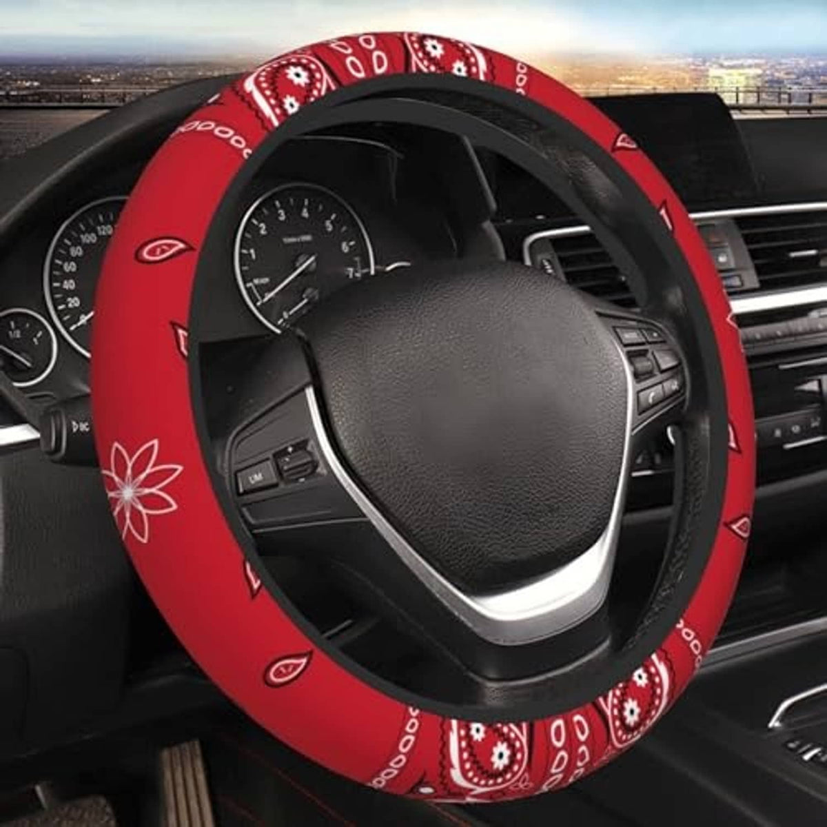 Red steering wheel cover with black border and colorful paisley pattern wrap