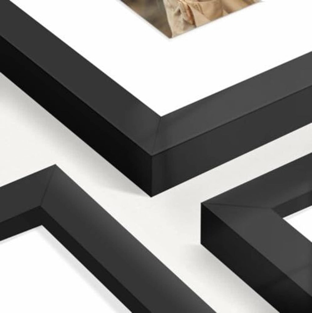 Close-up of a black picture frame corner with angled edge detail