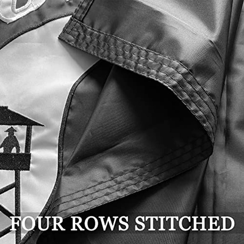 Close-up of reinforced flag hem with four rows of stitched edge on black fabric