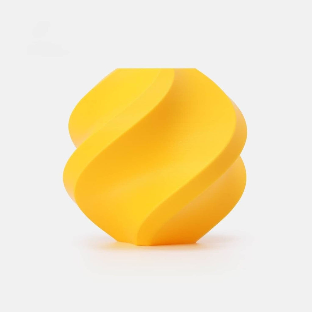 Matte sunflower yellow PLA filament coil on a spool, shown in a top view