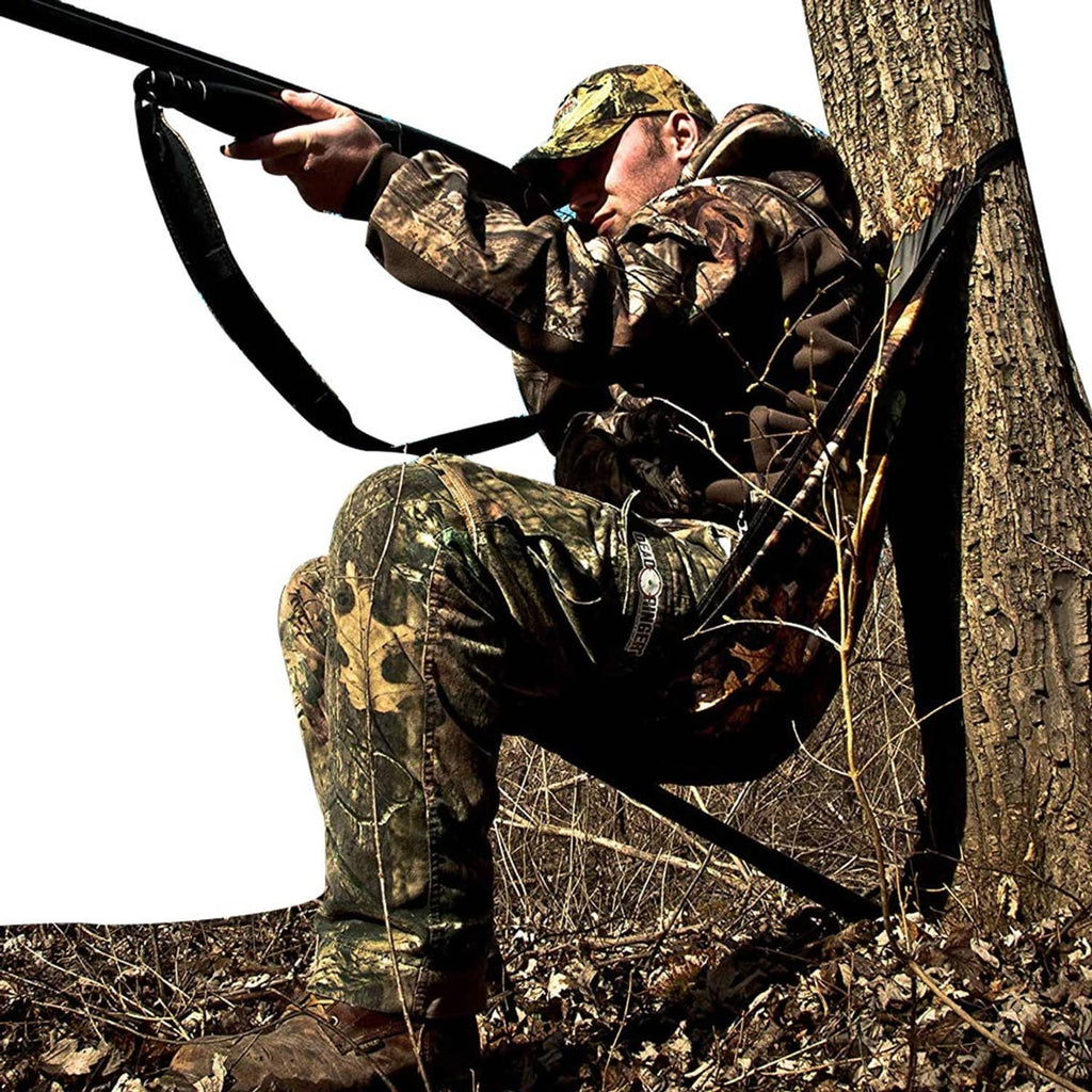 Camouflage hammock-style camping chair, open fabric seat suspended from a tree