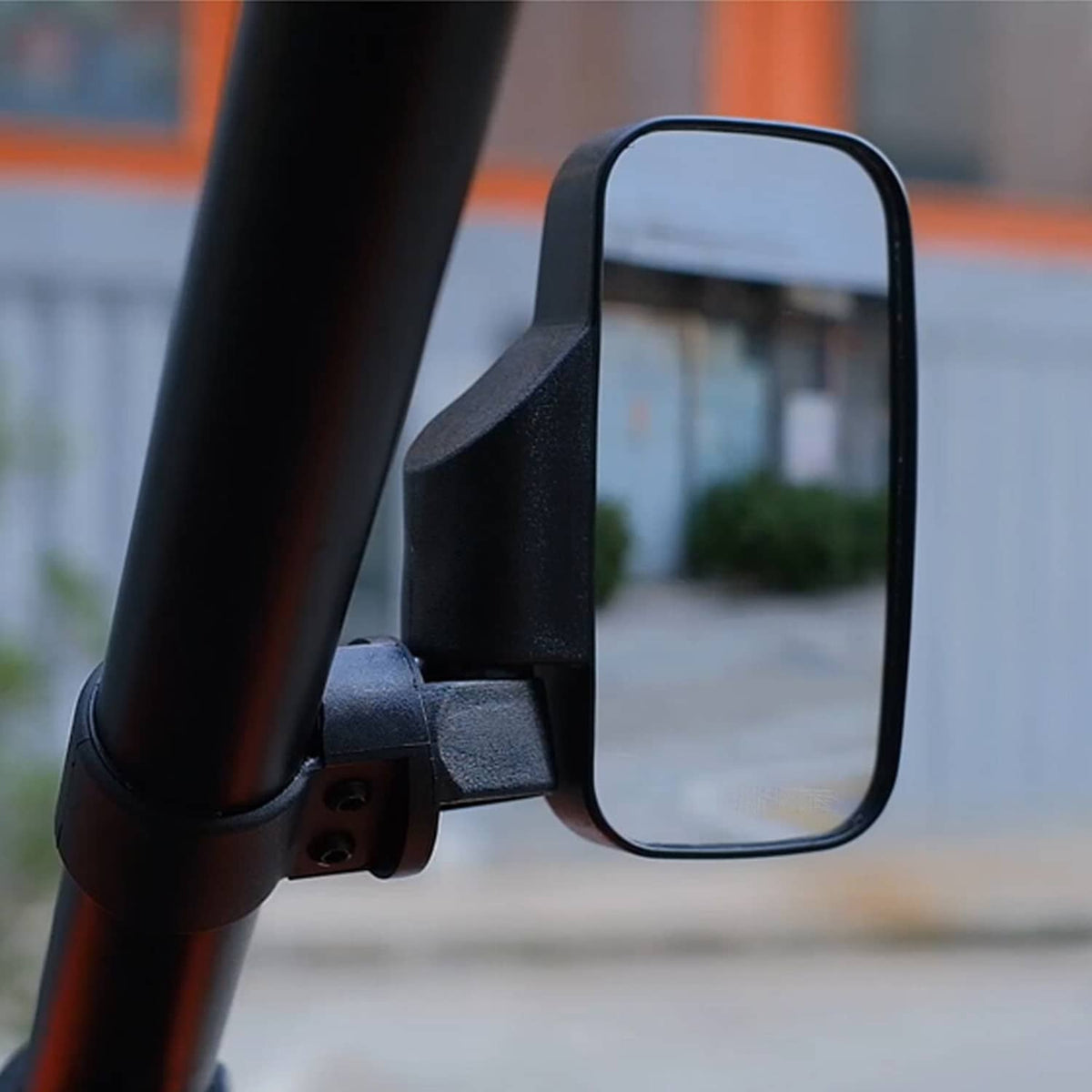 Black UTV rear view side mirror with clear glass mounted on a tubular frame