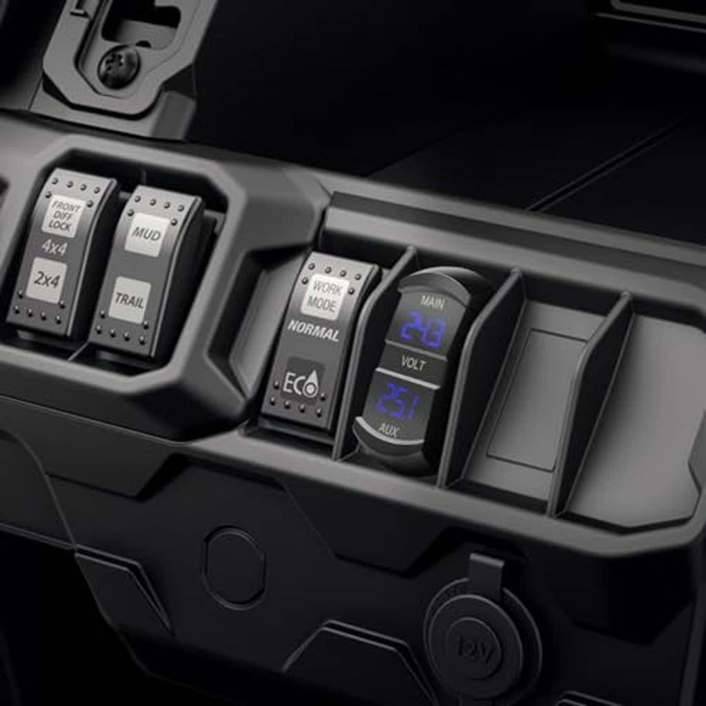 Black dual voltmeter gauge in vehicle console with blue LED MAIN and AUX digits