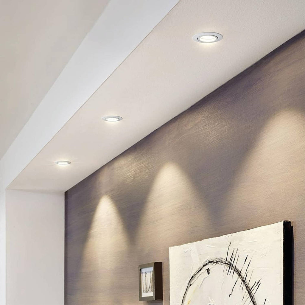 Recessed ceiling downlights with white trims and small circular light openings