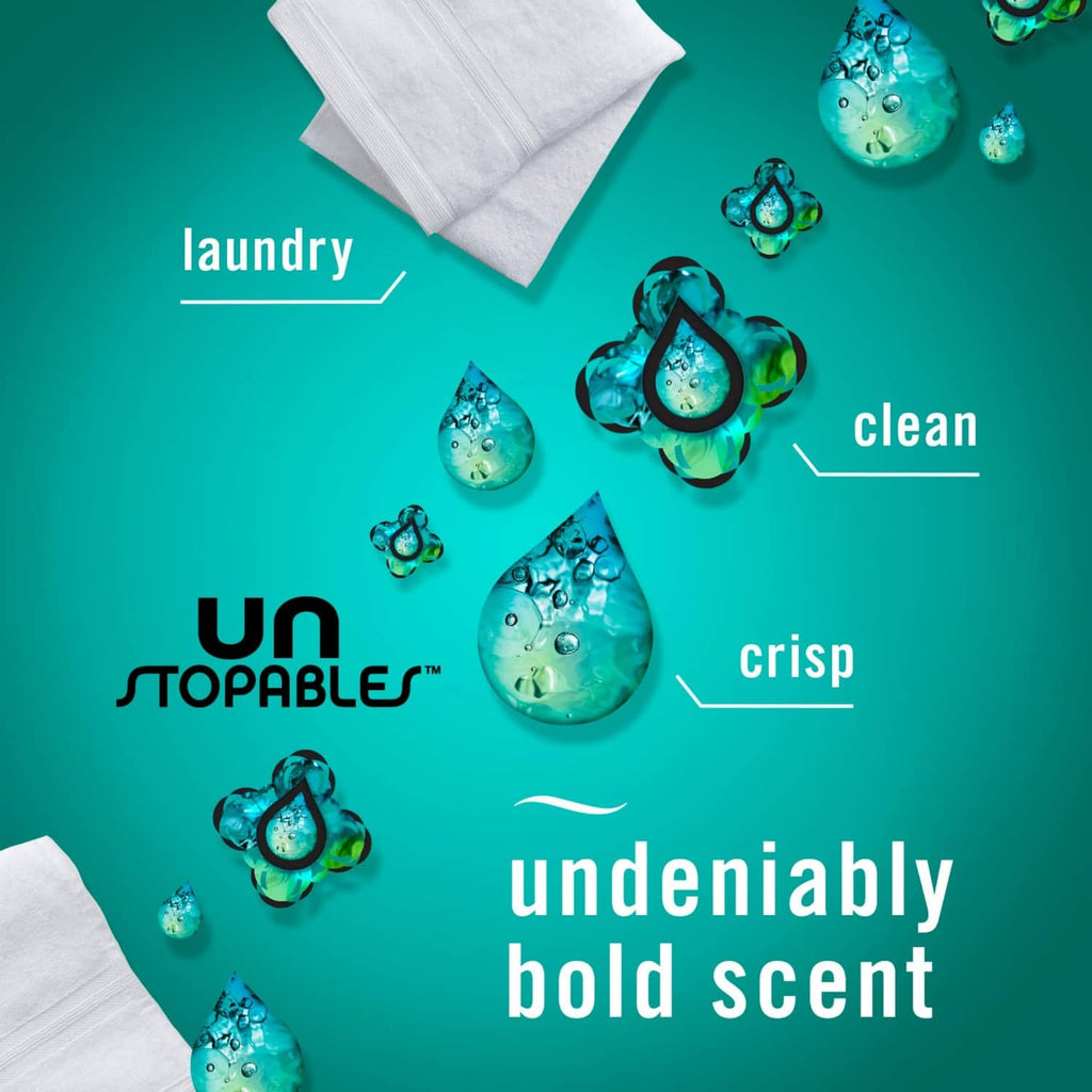 Blue trigger fabric spray bottle near folded white towels