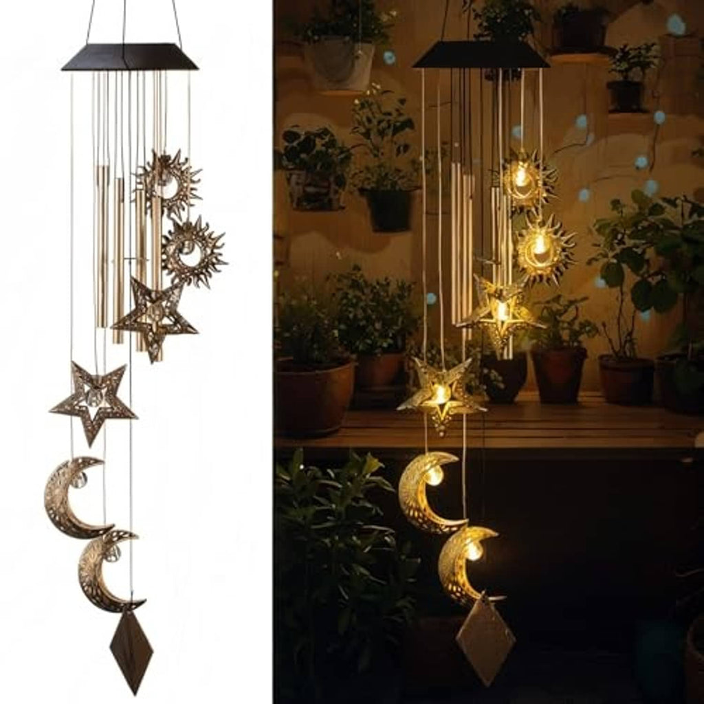 Solar wind chime with warm light and moon-and-star charms hanging from vertical rods