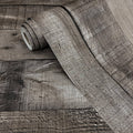 Gray shiplap peel-and-stick wallpaper roll with wood-grain plank pattern