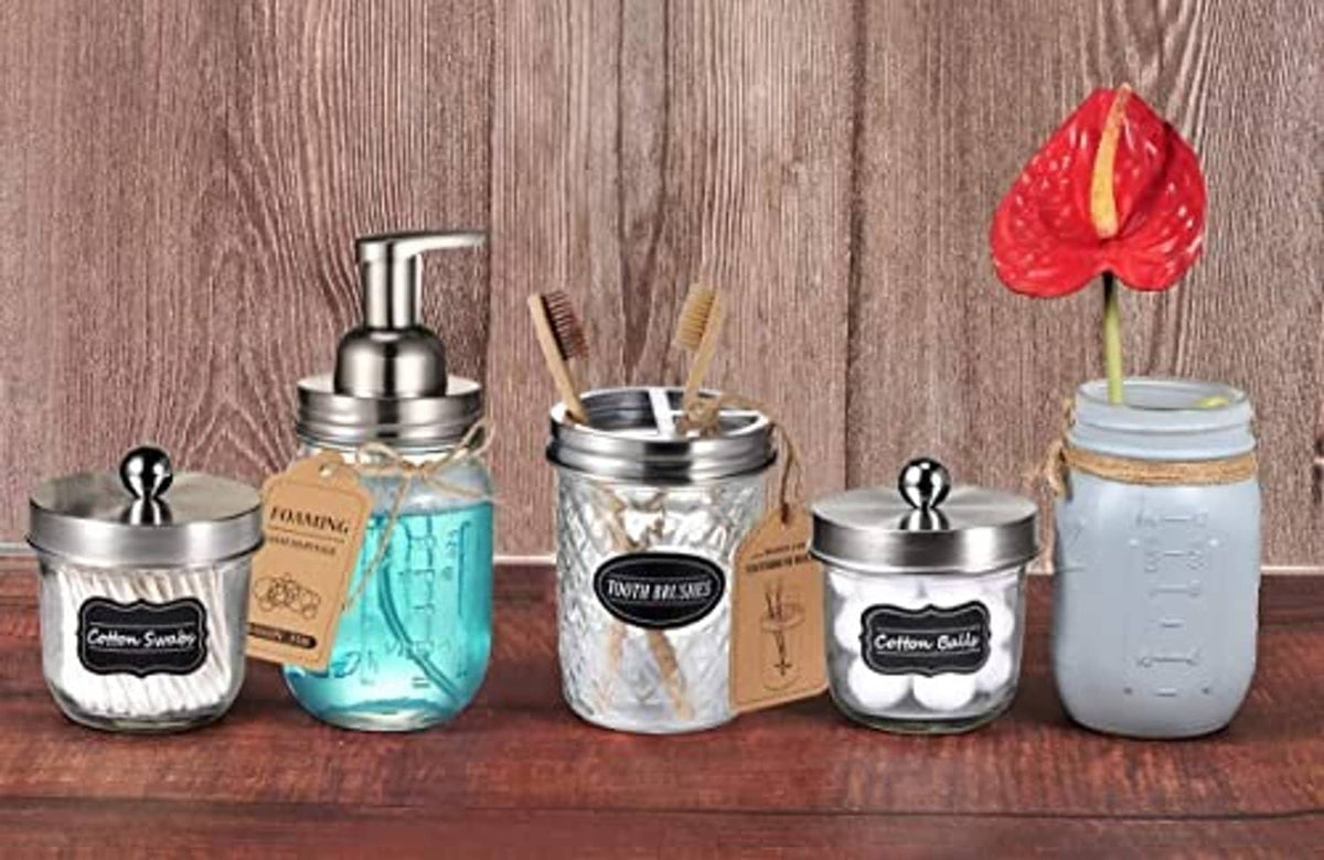 Stainless steel foaming dispenser pump lids on mason jars with integrated white dispensing tubes