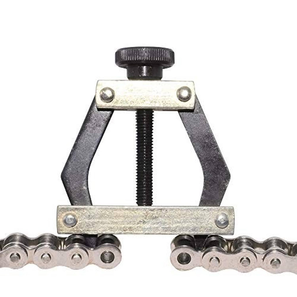 Roller chain connecting puller holder pressing between chain links, gold plate and black screw