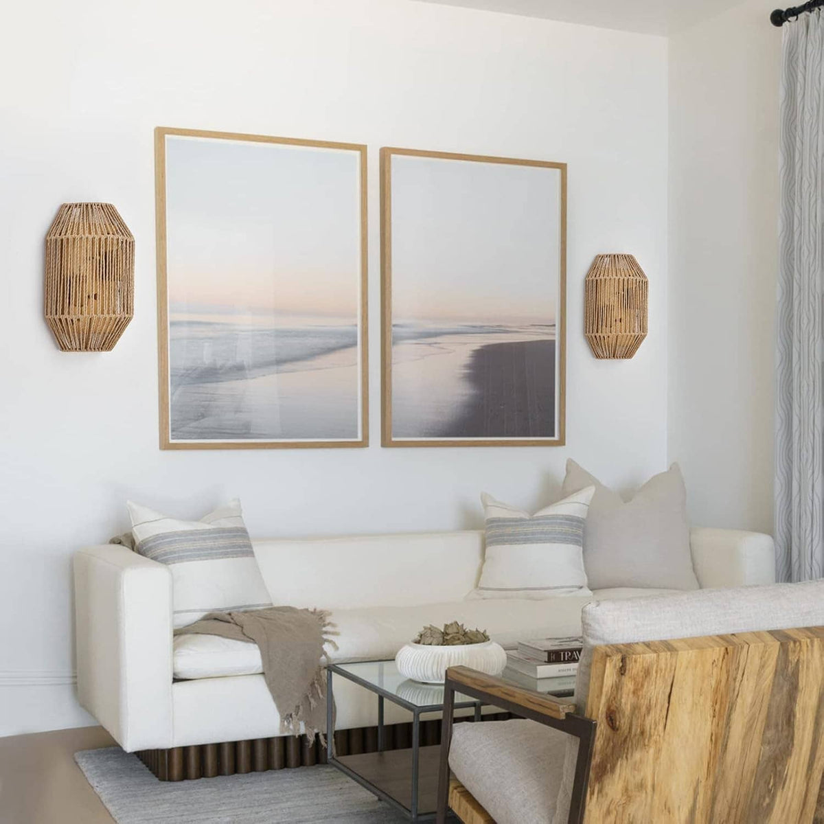 Two woven rattan wall sconces mounted on the wall with brass-toned details