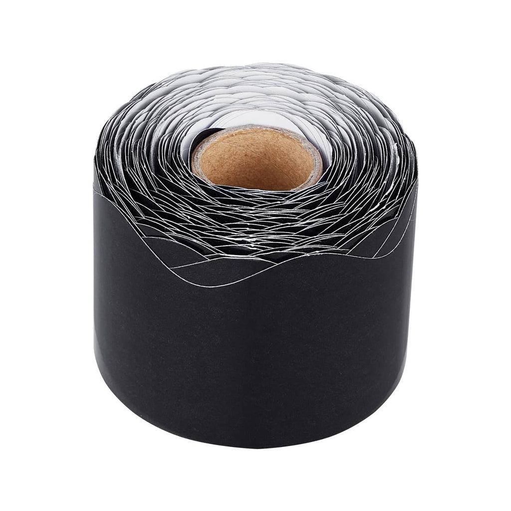 Black rolled scalloped border trim with inner cardboard core visible in the coil