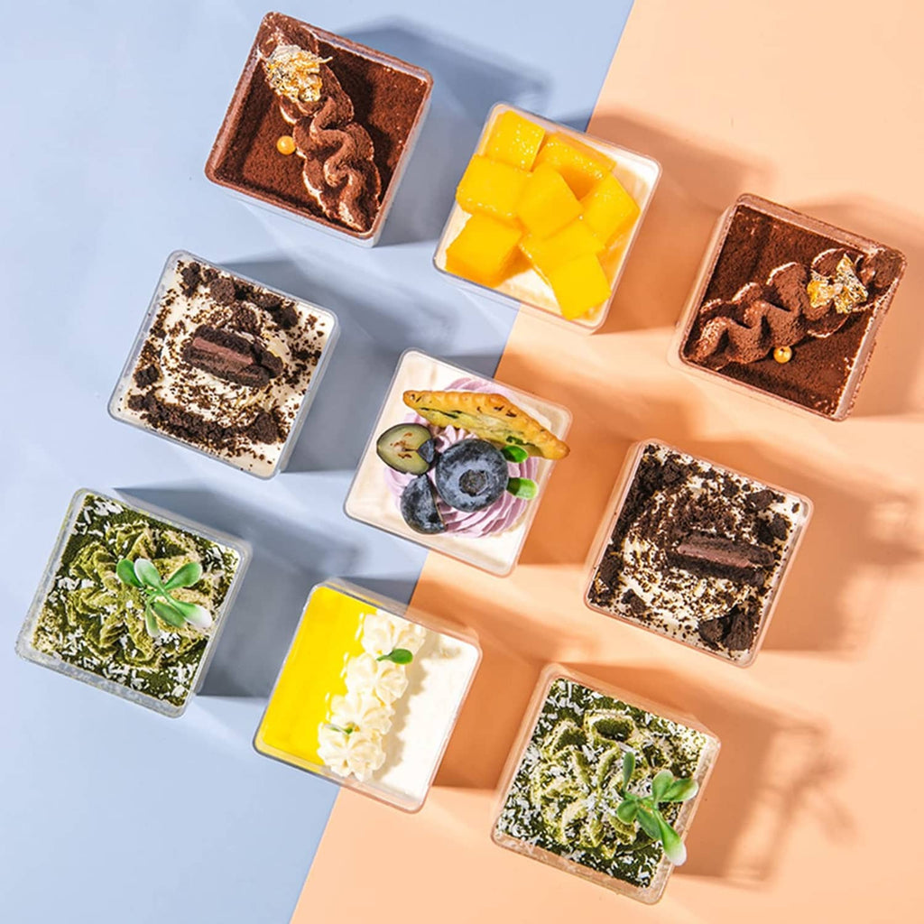 Clear square plastic cups arranged for serving bite-size desserts
