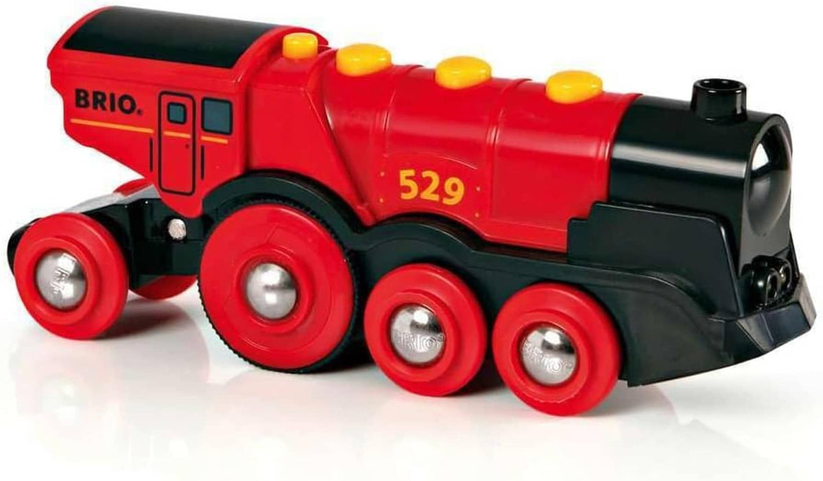 Close-up of red and black toy locomotive with yellow dome lights and 4 round wheels