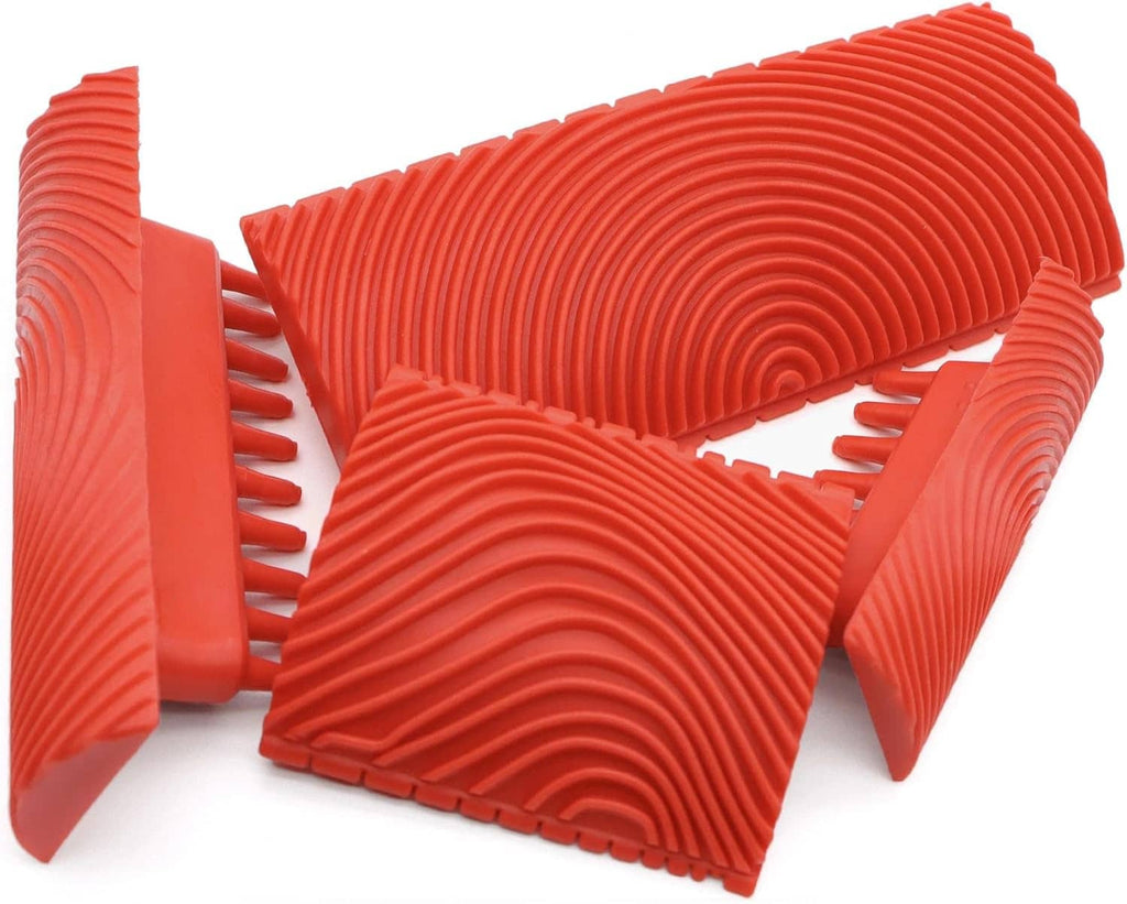 Red ribbed rubber wood-grain stamp tool pieces with curved ridges for decor painting