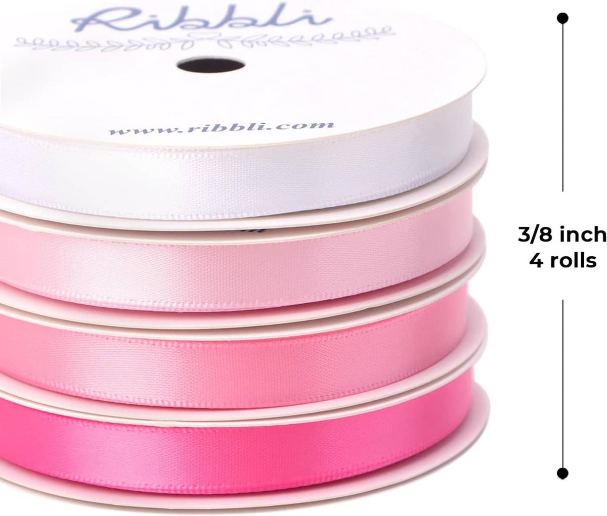 Stacked satin ribbon rolls, 3/8 inch width, pink ribbon on spools