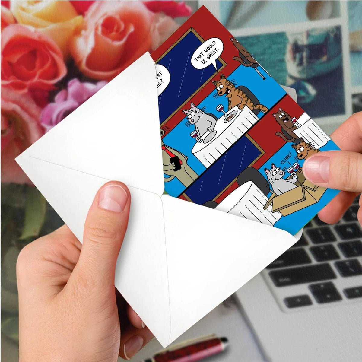 Anniversary note card with cartoon couple, partially pulled from white envelope in hand
