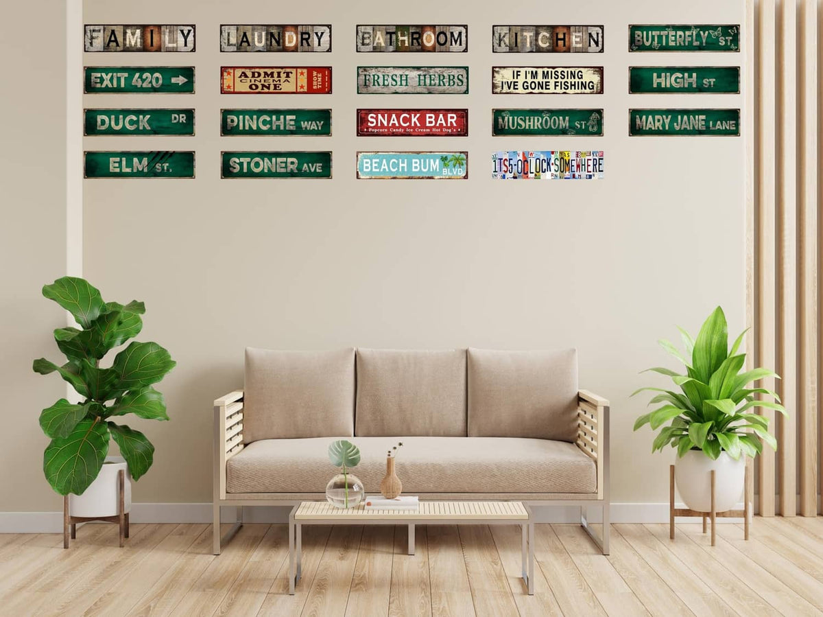 Small “BEACH BUM BLVD” street sign among other vintage address signs