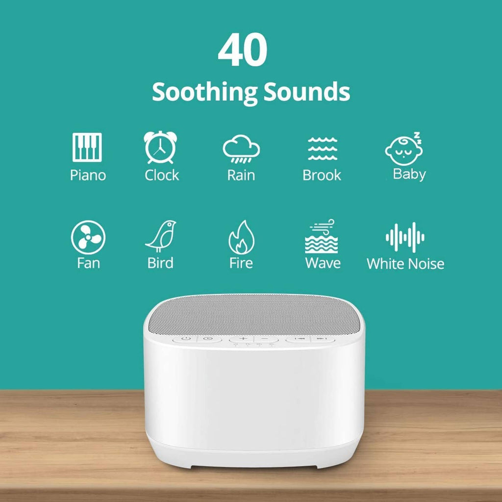 White tabletop sound machine with top speaker grille and control panel