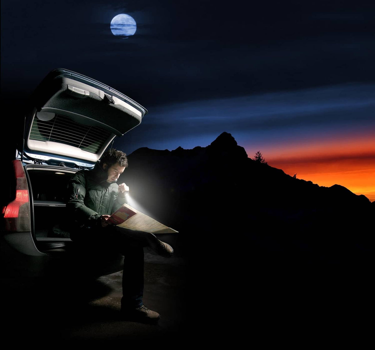Handheld blue LED flashlight casting a bright beam for nighttime use