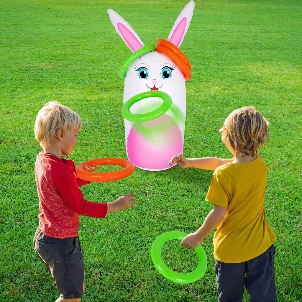 Inflatable bunny yard game with green and orange rings, kids playing on grass