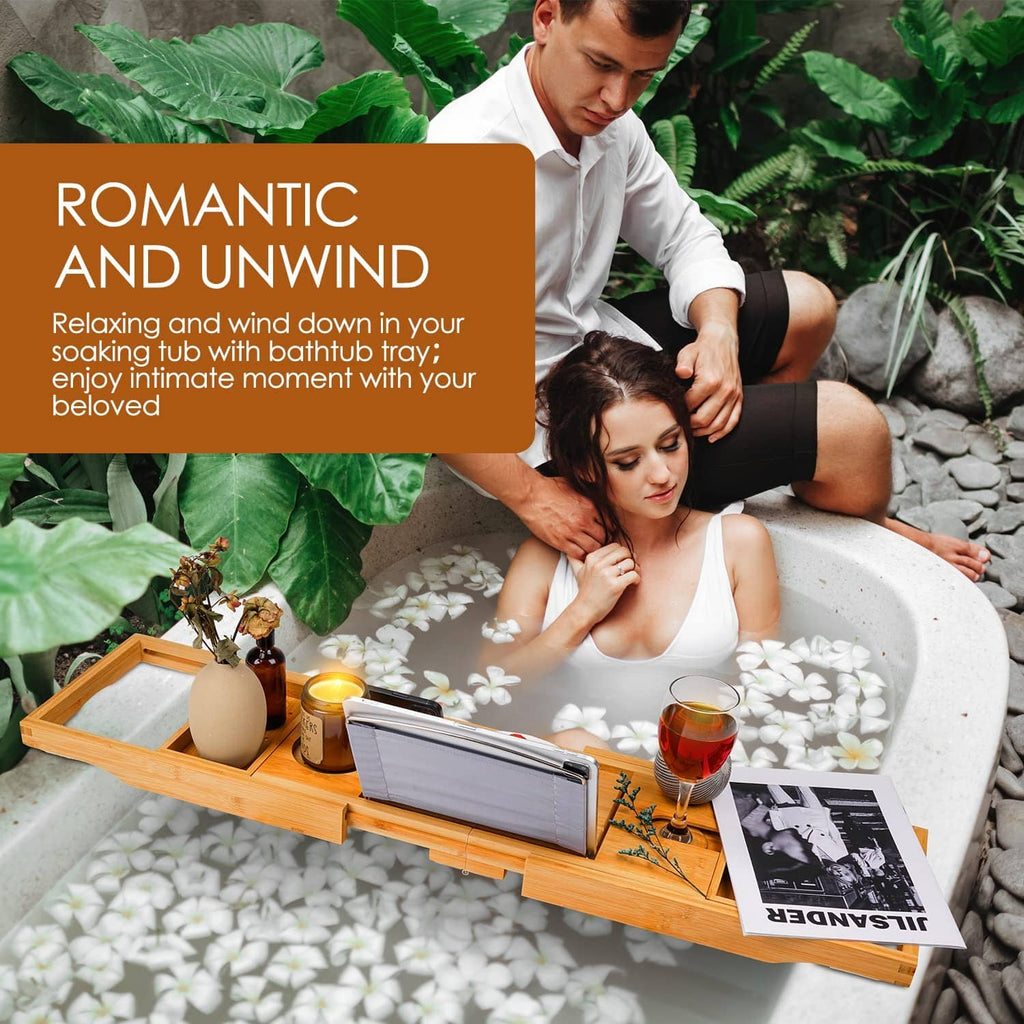 Beige bamboo bathtub caddy tray with drink and phone on an extended frame