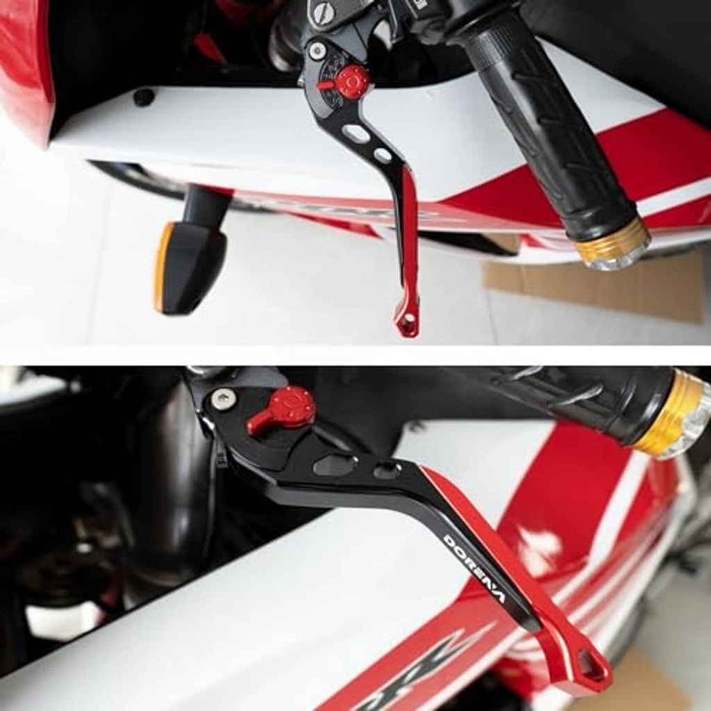 Installed motorcycle brake and clutch lever set, black arms and red pivot dial near fork