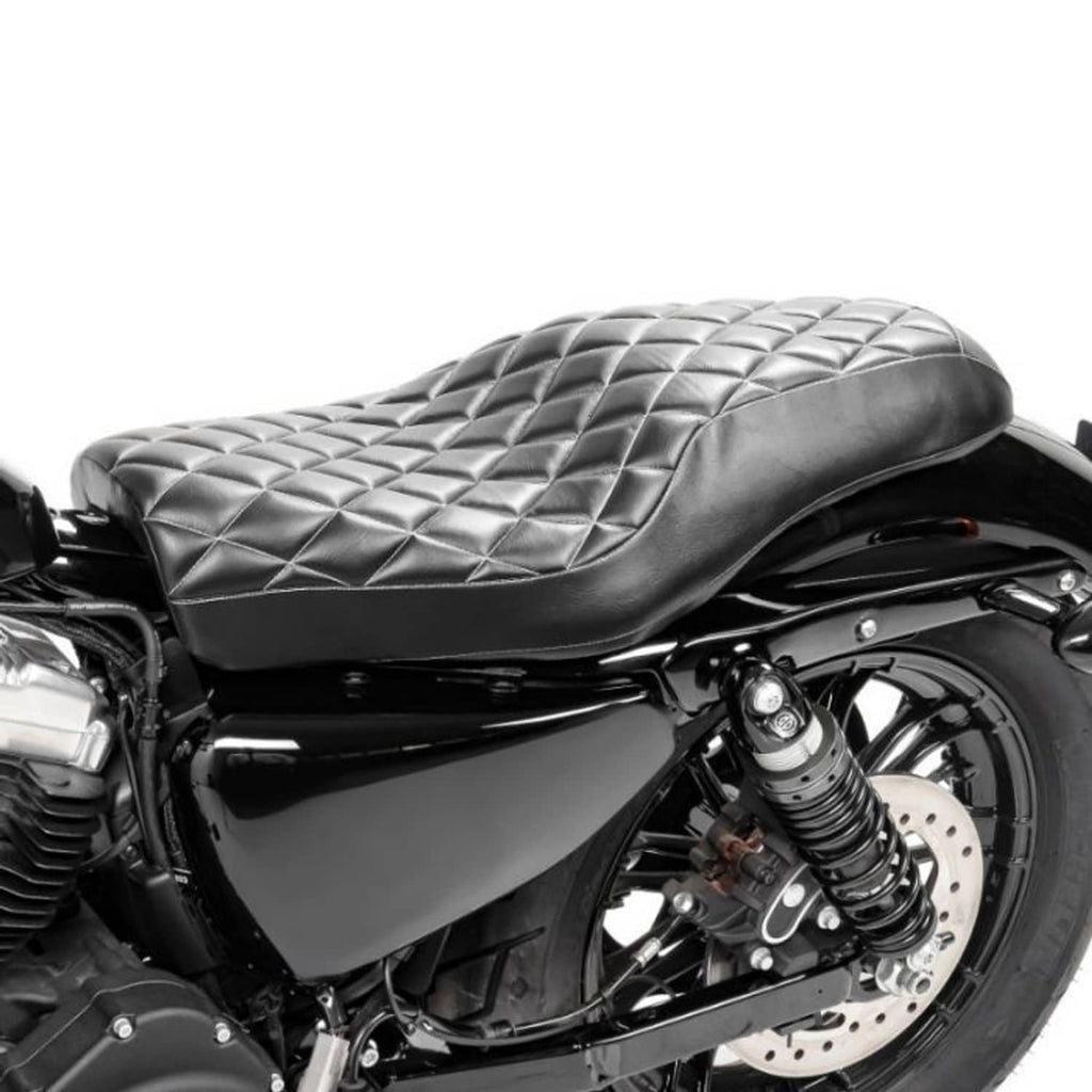 Black two-up motorcycle seat with diamond-quilt stitching and white piping
