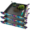 Black folding plant repotting tray set with colorful leaf print edges and handles