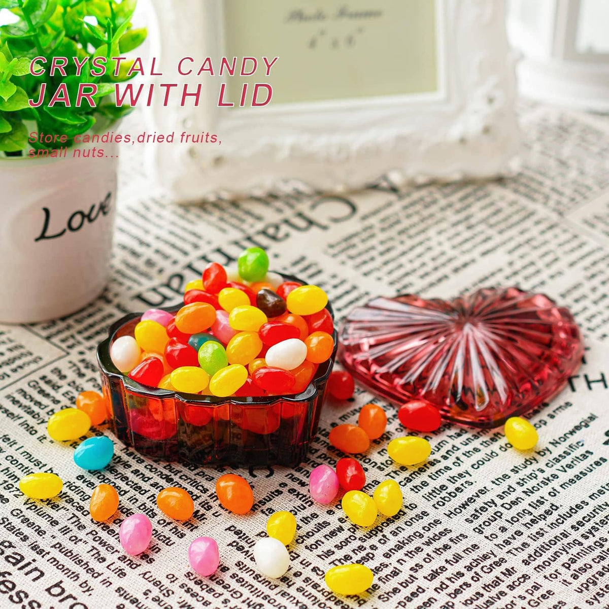 Red heart-shaped crystal candy jar with lid, filled with colorful candies