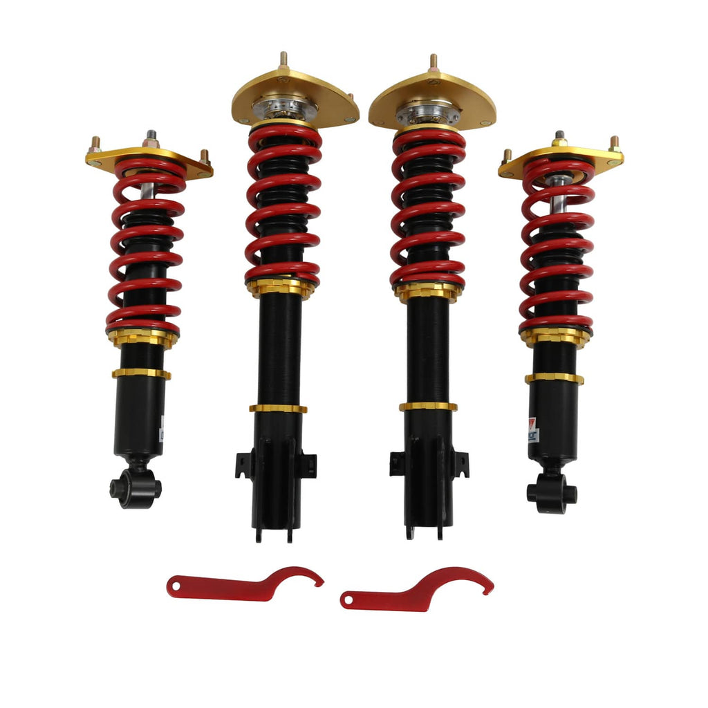 Set of four coilover struts: red springs, black dampers, gold upper plates, red clips