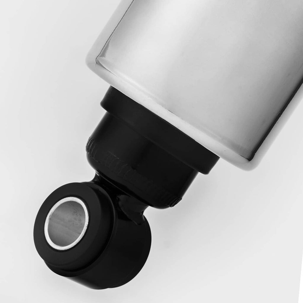 Close-up of chrome adjustable lowering shock end with black rubber bushing and bearing ring