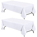 White tablecloth set draped over a 6-foot table, corners and legs visible