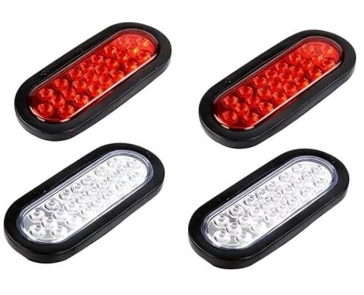Set of oval LED trailer tail lights, black housing, red and clear lenses
