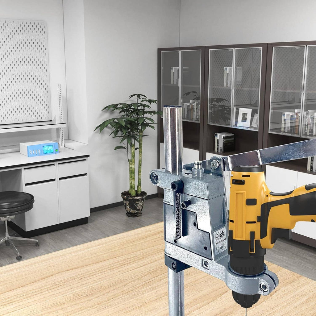 Drill stand with gray clamp housing and tall metal column holding a hand drill
